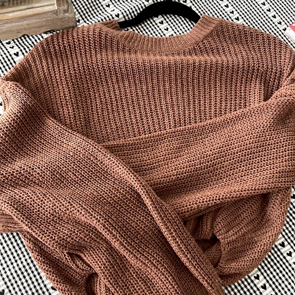 This is a brown sweater it’s a little bit cropped.